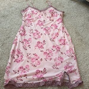 Pink spaghetti strap sundress with rose detail.